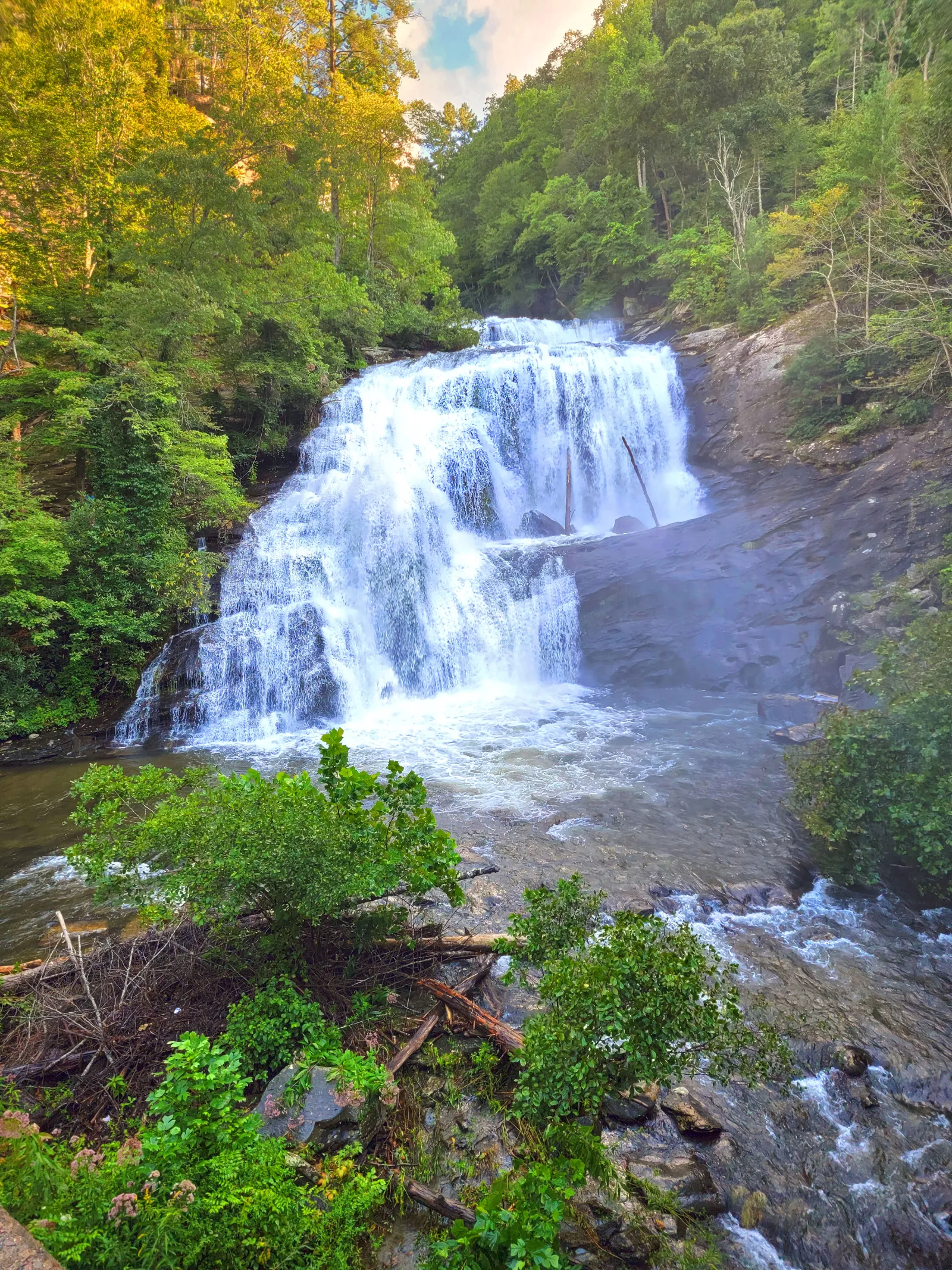 Bald River Falls in late afternoon, a wide cascade falling into a rocky pool in the gorge